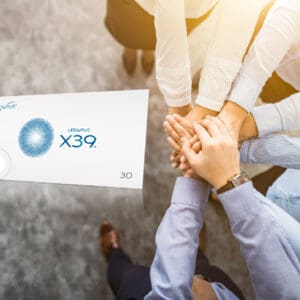Hands united above X39 product package.