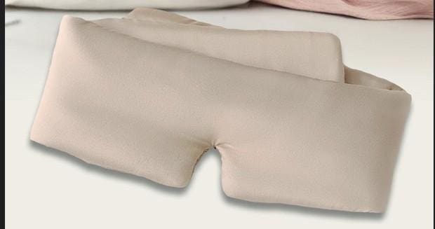Beige pillow with center cutout